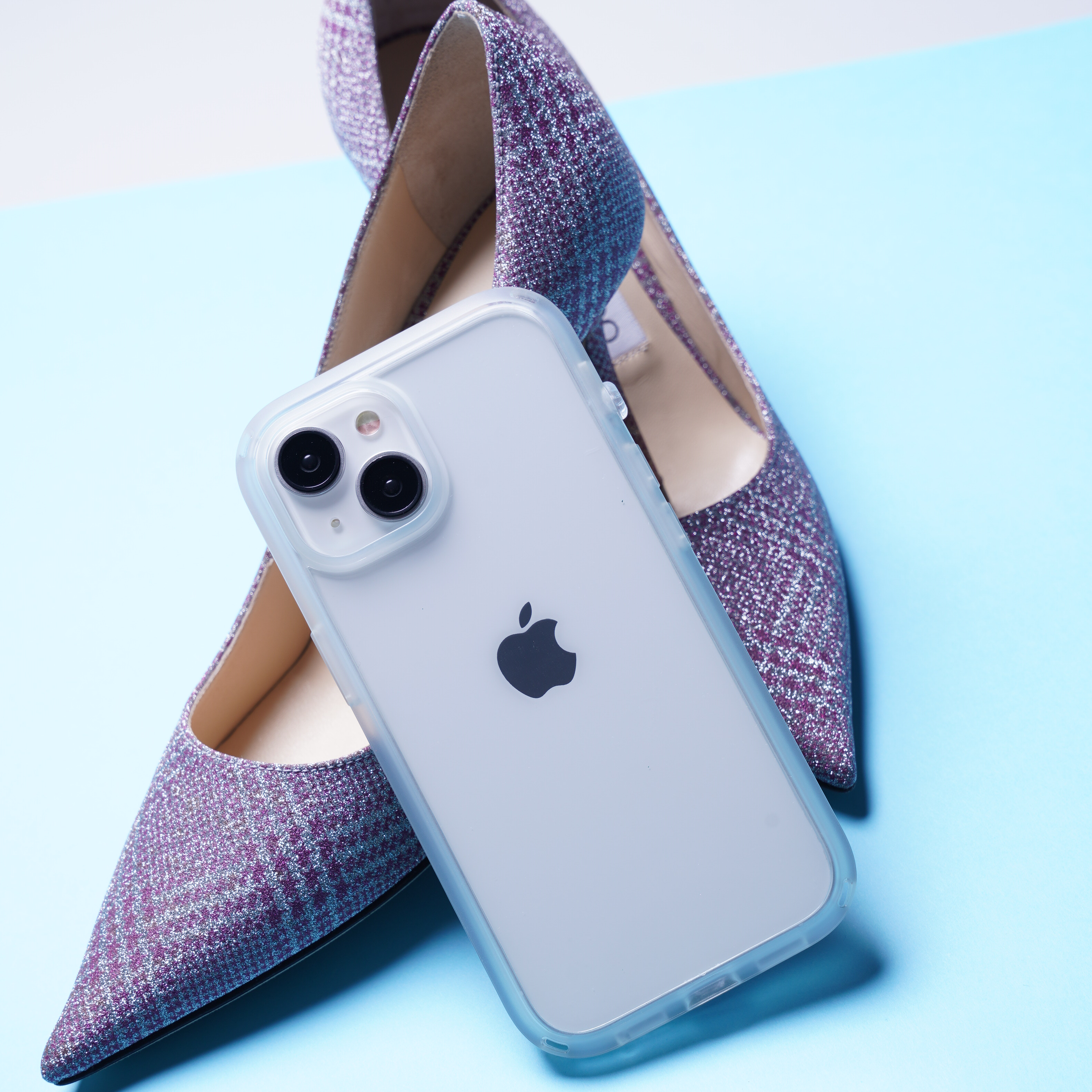 Catalyst iphone 15 series influence case iphone 15 in clear colorway leaning on a purple stiletto