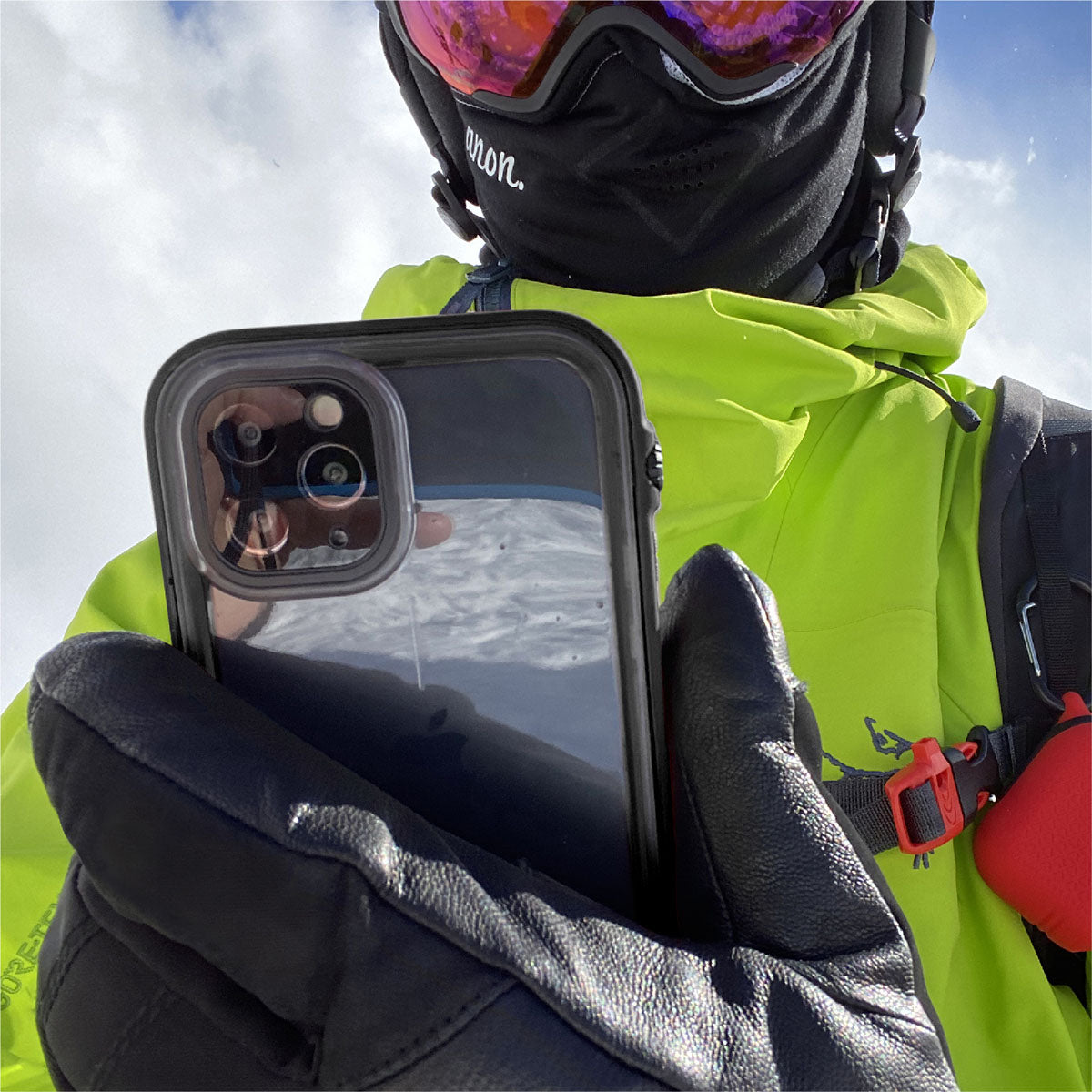 Catalyst iphone 11 series waterproof case in iphone 11 pro max showing the man holding his phone with the case in a stealth black colorway.